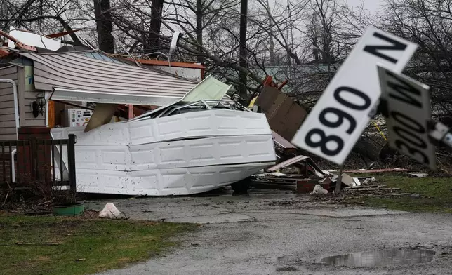 Wind damage and debris sit at a home in the aftermath of a powerful storm that ripped through the area a day earlier in Lake Village, Ind., Wednesday, March 11, 2026. (AP Photo/Nam Y. Huh)