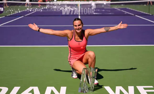 Aryna Sabalenka, of Belarus, poses for photos after defeating Elena Rybakina, of Kazakhstan, to win the BNP Paribas Open tennis tournament Sunday, March 15, 2026, in Indian Wells, Calif. (AP Photo/Mark J. Terrill)