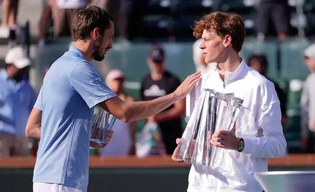 Jannik Sinner, of Italy, right, is congratulated by Daniil Medvedev, of Russia, after Sinner defeated Medvedev during a final match at the BNP Paribas Open tennis tournament, Sunday, March 15, 2026, in Indian Wells, Calif. (AP Photo/Mark J. Terrill)