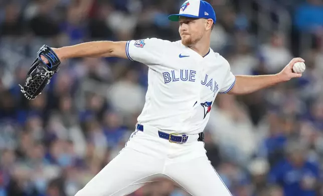 Toronto Blue Jays pitcher Eric Lauer (56) pitches against the Athletics during first inning American League baseball action in Toronto on Sunday, March 29, 2026. (Nathan Denette/The Canadian Press via AP)