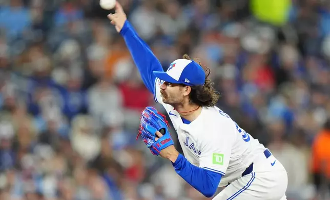 Toronto Blue Jays pitcher Dylan Cease (84) throws during the first inning of a baseball game against the Athletics in Toronto Saturday, March 28, 2026. (Frank Gunn/The Canadian Press via AP)