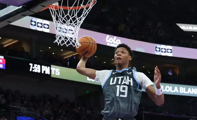 Utah Jazz guard Ace Bailey goes up for a dunk against the Toronto Raptors during the first half of an NBA basketball game, Monday, March 23, 2026, in Salt Lake City. (AP Photo/Rob Gray)