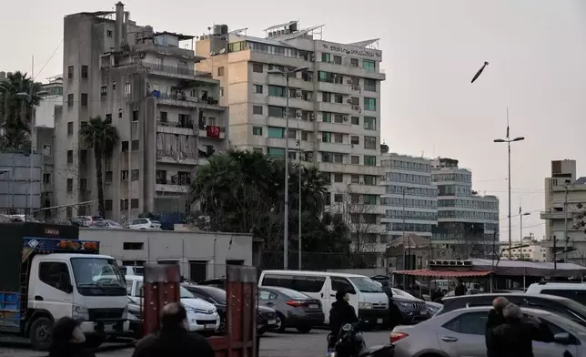 A projectile approaches its target during an Israeli strike on a building in central Beirut, Lebanon, Thursday, March 12, 2026. (AP Photo/Bilal Hussein)