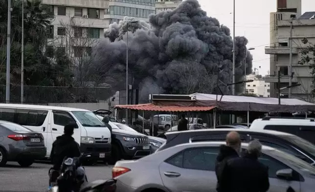 Smoke rises from a building after an Israeli targeted strike in central Beirut, Lebanon, Thursday, March 12, 2026.(AP Photo/Bilal Hussein)