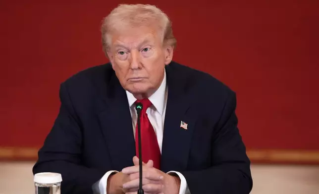 President Donald Trump listens during a roundtable discussion on college sports in the East Room of the White House, Friday, March 6, 2026, in Washington. (AP Photo/Julia Demaree Nikhinson)