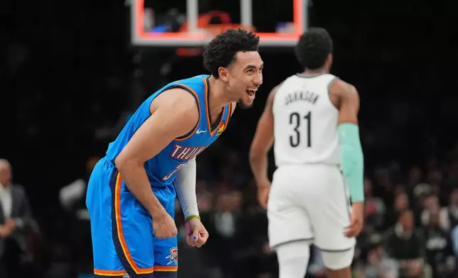 Oklahoma City Thunder's Jared McCain (3) celebrates after scoring during the second half of an NBA basketball game against the Brooklyn Nets Wednesday, March 18, 2026, in New York. (AP Photo/Frank Franklin II)