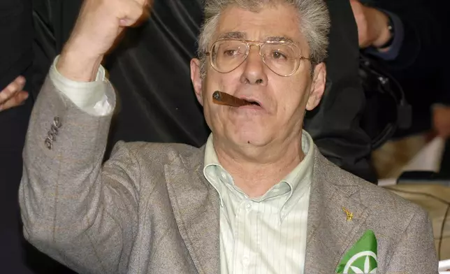 Leader of the Northern League party Umberto Bossi celebrates at the party headquarters in Milan, Italy, April 14, 2008. Bossi died at the age of 84 on Thursday, March 19, 2026. (AP Photo/Luca Bruno, File)