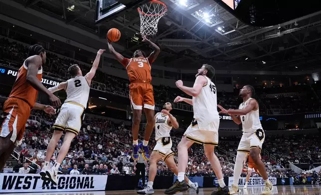 Texas forward Dailyn Swain (3) drives to the basket during the first half in the Sweet 16 of the NCAA college basketball tournament against Purdue, Thursday, March 26, 2026, in San Jose, Calif. (AP Photo/Godofredo A. Vásquez)