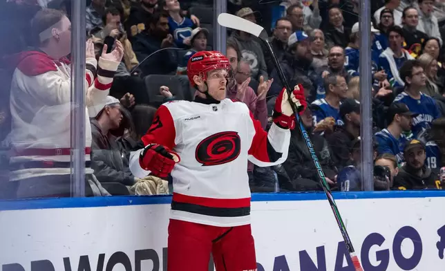 Carolina Hurricanes' Nikolaj Ehlers celebrates his goal against the Vancouver Canucks during the second period of an NHL hockey game in Vancouver, on Wednesday, March 4, 2026. (Ethan Cairns/The Canadian Press via AP)