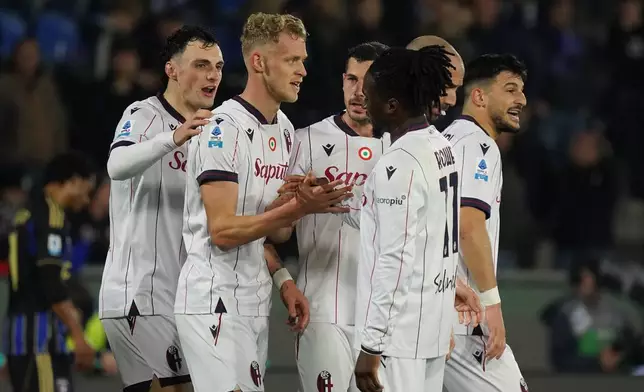 Bologna's Jens Odgard, 2nd left, celebrates with teammates after scoring, during the Serie A soccer match between Pisa and Bologna, in Pisa, Italy, Monday, March 2, 2026. (Alessandro La Rocca/LaPresse via AP)