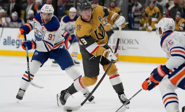Vegas Golden Knights center Jack Eichel (9) shoots against the Edmonton Oilers during the second period of an NHL hockey game Sunday, March 8, 2026, in Las Vegas. (AP Photo/John Locher)