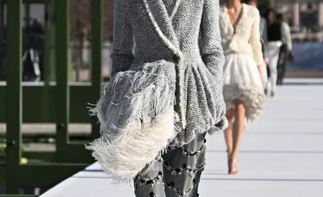 A model wears a creation from the Christian Dior Fall/Winter 2026-2027 Women's collection presented in Paris, Tuesday, March 3, 2026. (AP Photo/Emma Da Silva)