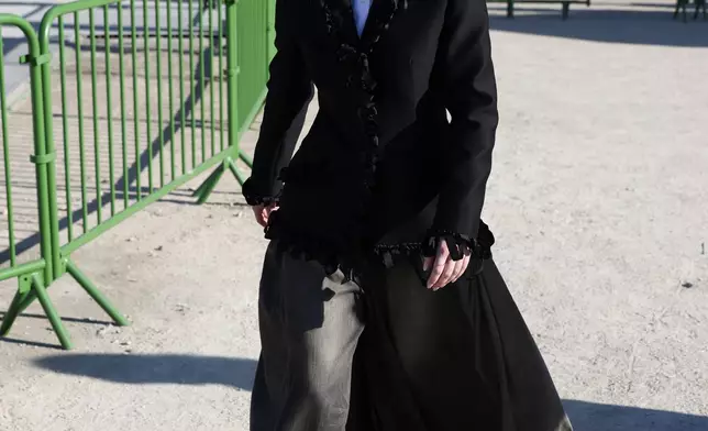 Florence Hunt departs the Christian Dior Fall/Winter 2026-2027 Women's collection presented in Paris, Tuesday, March 3, 2026. (AP Photo/Tom Nicholson)