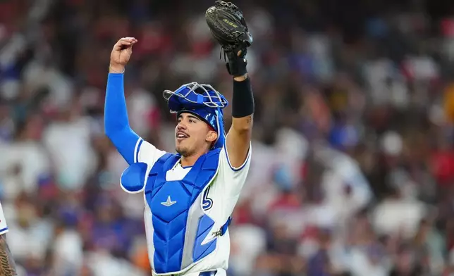 Italy catcher JJ D'Orazio celebrates a victory over Puerto Rico following a World Baseball Classic quarterfinal game, Saturday, March 14, 2026, in Houston. (AP Photo/Karen Warren)