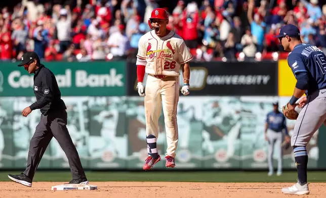St. Louis Cardinals' JJ Wetherholt reacts after driving in the game-winning runs in the tenth inning of a baseball game against the Tampa Bay Rays, Saturday, March 28, 2026, in St. Louis. (AP Photo/Scott Kane)