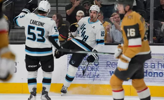 Utah Mammoth center Jack McBain (22) celebrates after scoring against the Vegas Golden Knights during the first period of an NHL hockey game Thursday, March 19, 2026, in Las Vegas. (AP Photo/John Locher)