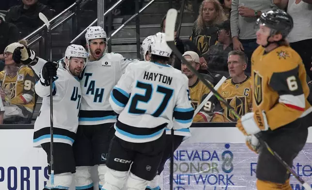 Utah Mammoth center Jack McBain (22) celebrates after scoring against the Vegas Golden Knights during the first period of an NHL hockey game Thursday, March 19, 2026, in Las Vegas. (AP Photo/John Locher)