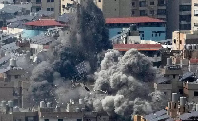 Smoke rises following an Israeli airstrike in Dahiyeh, Beirut's southern suburbs, in Beirut, Lebanon, Friday, March 6, 2026. (AP Photo/Hussein Malla)