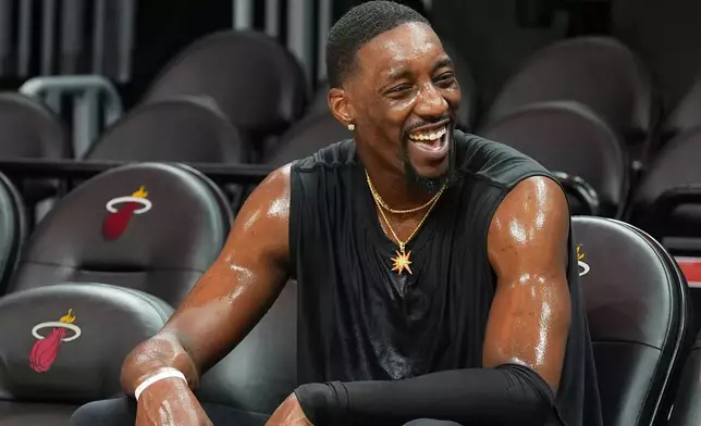 Miami Heat center Bam Adebayo warms up before a game against the Milwaukee Bucks Thursday, March 12, 2026, in Miami. (AP Photo/Marta Lavandier)