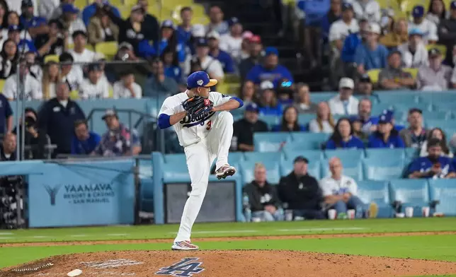 Los Angeles Dodgers relief pitcher Edwin Diaz (3) pitches during the first inning of a baseball game against the Arizona Diamondbacks, Friday, March 27, 2026, in Los Angeles. (AP Photo/Caroline Brehman)
