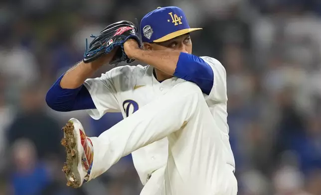 Los Angeles Dodgers relief pitcher Edwin Diaz throws to the plate during the ninth inning of a baseball game against the Arizona Diamondbacks, Friday, March 27, 2026, in Los Angeles. (AP Photo/Mark J. Terrill)