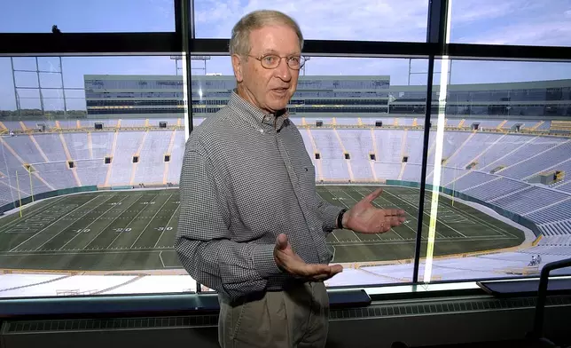 FILE - Green Bay Packers President Bob Harlan talks about the renovation of Lambeau Field from a luxury box in the stadium, July 28, 2003, in Green Bay, Wis. (AP Photo/Morry Gash, File)