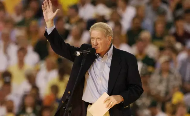 FILE - Green Bay Packers president Bob Harlan waves to the crowd at the renovated Lambeau Field on Sept. 6, 2003, in Green Bay, Wis. (AP Photo/Mike Roemer, File)