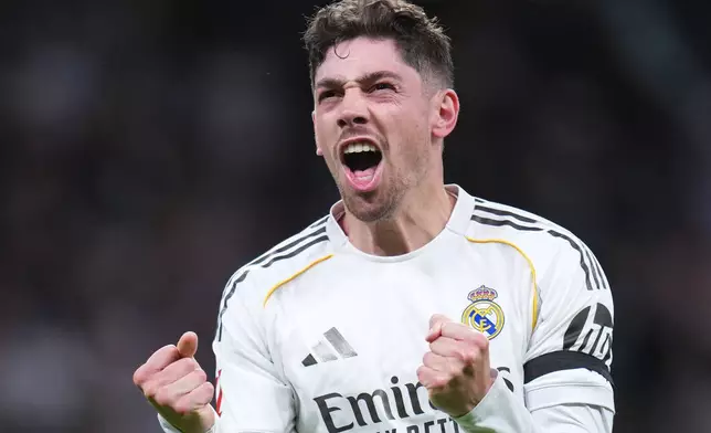 Real Madrid's Federico Valverde celebrates after scoring his side's second goal during a Spanish La Liga soccer match between Real Madrid and Elche CF, in Madrid, Saturday, March 14, 2026. (AP Photo/Manu Fernandez)