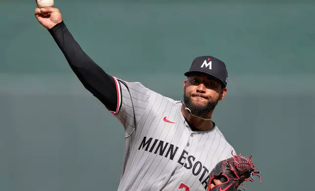 Minnesota Twins starting pitcher Simeon Woods Richardson throws during the first inning of a baseball game against the Kansas City Royals, Monday, March 30, 2026, in Kansas City, Mo. (AP Photo/Charlie Riedel)