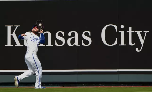 Kansas City Royals center fielder Kyle Isbel catches a fly ball for the out on Minnesota Twins' Ryan Jeffers during the first inning of a baseball game, Monday, March 30, 2026, in Kansas City, Mo. (AP Photo/Charlie Riedel)