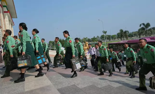 CORRECTS THE YEAR - Myanmar's military representatives arrive to attend for a session at Lower House parliament in Naypyitaw, Myanmar, Monday, March 16, 2026. (AP Photo/Aung Shine Oo)