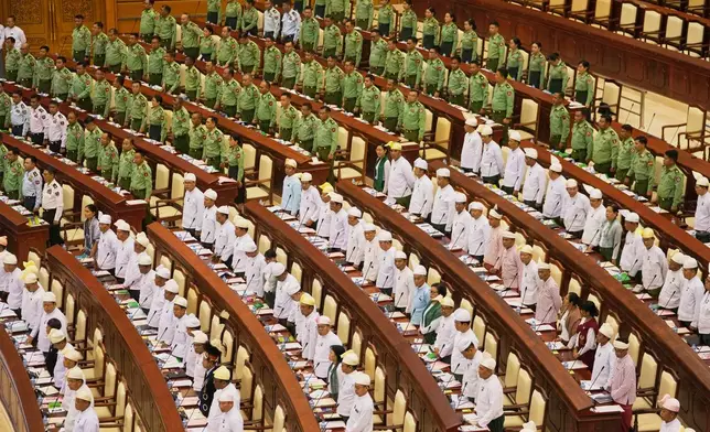 Myanmar's military representatives and Lawmakers take oath during a parliament session at Lower House in Naypyitaw, Myanmar, Monday, March 16, 2026. (AP Photo/Aung Shine Oo)