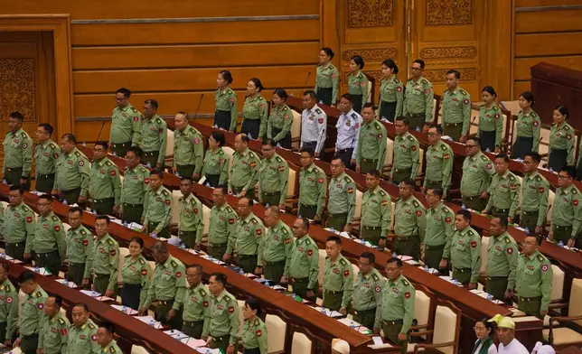 Myanmar's military representatives take oath during a parliament session at Lower House in Naypyitaw, Myanmar, Monday, March 16, 2026. (AP Photo/Aung Shine Oo)