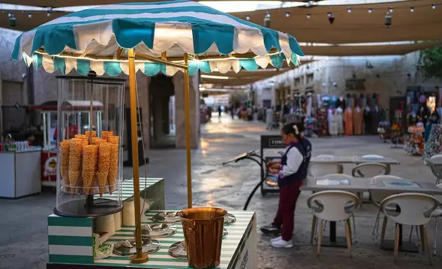 An ice cream stand sits in empty Al Seef market, next to the historic Al Fahidi neighborhood along Dubai Creek, one of the main tourist areas of Dubai, United Arab Emirates, Friday, March 13, 2026, as tourism slows amid regional tensions linked to the Iran war. (AP Photo/Fatima Shbair)