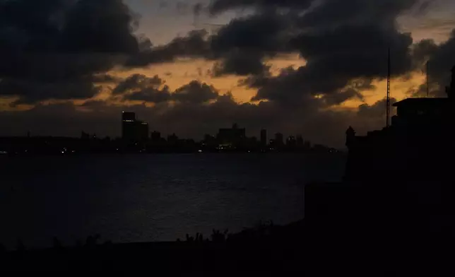 Clouds gather above Havana during a blackout, Wednesday, March 4, 2026. (AP Photo/Ramon Espinosa)