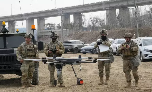 U.S. Army soldiers operate their drone during a joint river-crossing exercise between South Korea and the United States as a part of the Freedom Shield military exercise in Yeoncheon, South Korea, Saturday, March 14, 2026. (AP Photo/Ahn Young-joon)