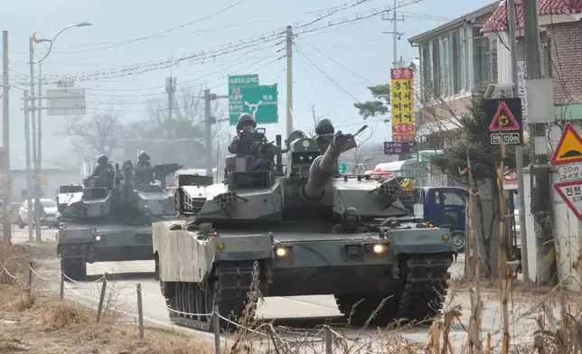 South Korean army's tanks move to attend a joint river-crossing exercise between South Korea and the United States as a part of the Freedom Shield military exercise in Yeoncheon, South Korea, Saturday, March 14, 2026. (AP Photo/Ahn Young-joon)