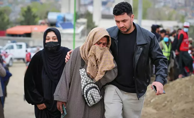 A woman weeps during a second mass funeral for victims killed in an airstrike that hit a drug rehabilitation center earlier this month, in Kabul, Afghanistan, Thursday, March 26, 2026. (AP Photo/Siddiqullah Alizai)