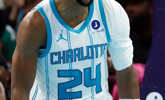 Charlotte Hornets forward Brandon Miller yells after scoring against the Philadelphia 76ers during the second half of an NBA basketball game in Charlotte, N.C., Saturday, March 28, 2026. (AP Photo/Nell Redmond)