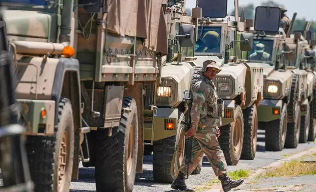 South African National Defense Forces deploy in the Riverlea township of Johannesburg, South Africa, Wednesday, March 11, 2026. (AP Photo/Themba Hadebe)