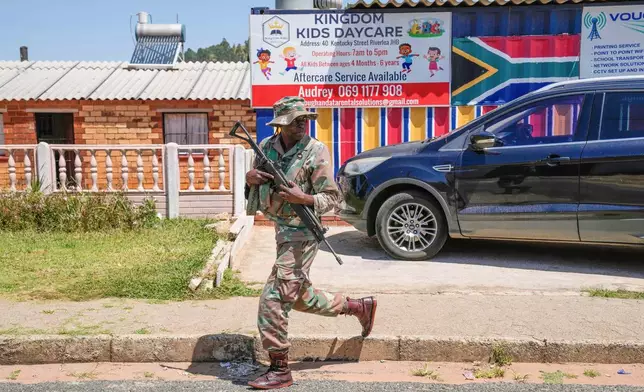 South African National Defense Forces deploy in the Riverlea township of Johannesburg, South Africa, Wednesday, March 11, 2026. (AP Photo/Themba Hadebe)