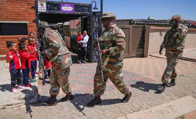South African National Defense Forces deploy in the Riverlea township of Johannesburg, South Africa, Wednesday, March 11, 2026. (AP Photo/Themba Hadebe)