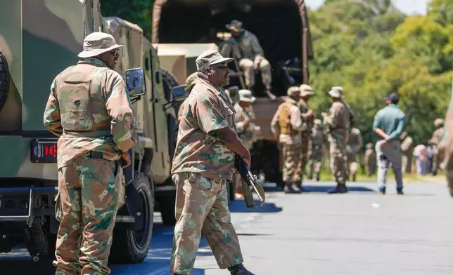 South African National Defense Forces deploy in the RIverlea township of Johannesburg, South Africa, Wednesday, March 11, 2026. (AP Photo/Themba Hadebe)