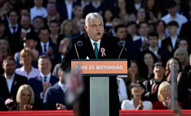 Hungary's Prime Minister Viktor Orban addresses his supporters during a march in Budapest, Hungary, Sunday, March 15, 2026. (AP Photo/Denes Erdos)