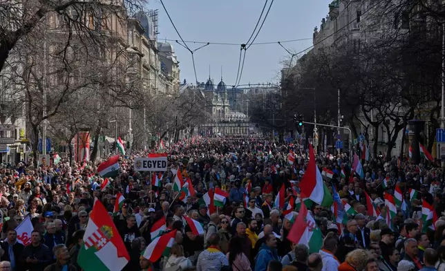 Supporters of Prime Minister Viktor Orban attend a pro-Orban march in Budapest, Hungary, Sunday, March 15, 2026. (AP Photo/Denes Erdos)
