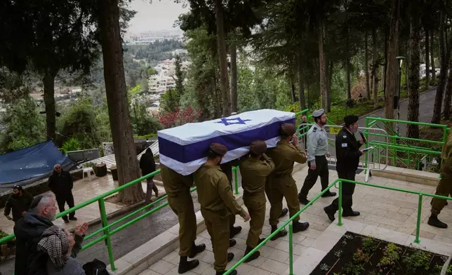 Israeli soldiers carry the flag-draped casket of Staff Sgt. Ori Greenberg who was killed in combat in Lebanon, during his funeral at Mount Herzl military cemetery in Jerusalem Thursday, March 26, 2026. (AP Photo/Mahmoud Illean)