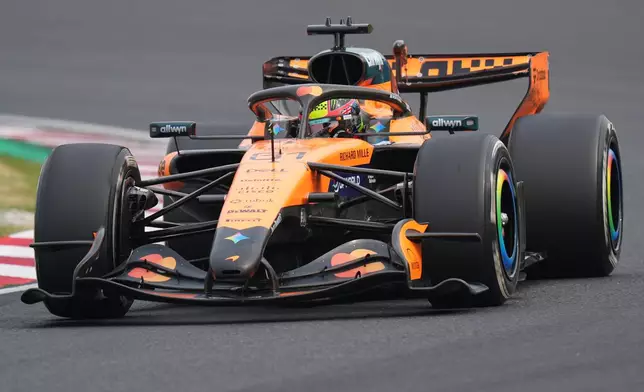 McLaren driver Oscar Piastri of Australia steers his car during the Japanese Formula One Grand Prix at Suzuka in central Japan, Sunday, March 29, 2026. (AP Photo/Eugene Hoshiko)