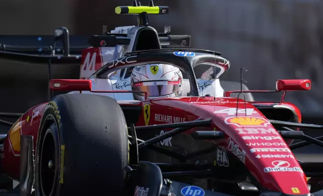 Ferrari driver Lewis Hamilton of Britain steers his car during the second practice session of the Japanese Formula One Grand Prix in Suzuka, Japan, Friday, March 27, 2026. (AP Photo/Hiro Komae)