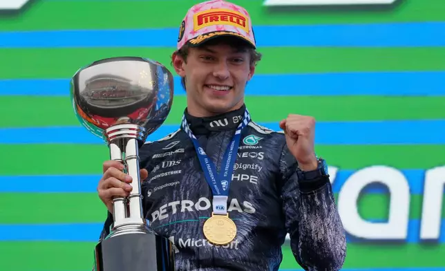 Mercedes driver Kimi Antonelli of Italy reacts on the podium after winning the Japanese Formula One Grand Prix at Suzuka in central Japan, Sunday, March 29, 2026. (AP Photo/Eugene Hoshiko)