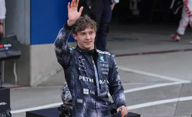 Mercedes driver Kimi Antonelli of Italy waves after winning the Japanese Formula One Grand Prix at Suzuka in central Japan, Sunday, March 29, 2026. (AP Photo/Hiro Komae)